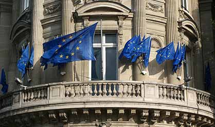 EU flags waving on a building